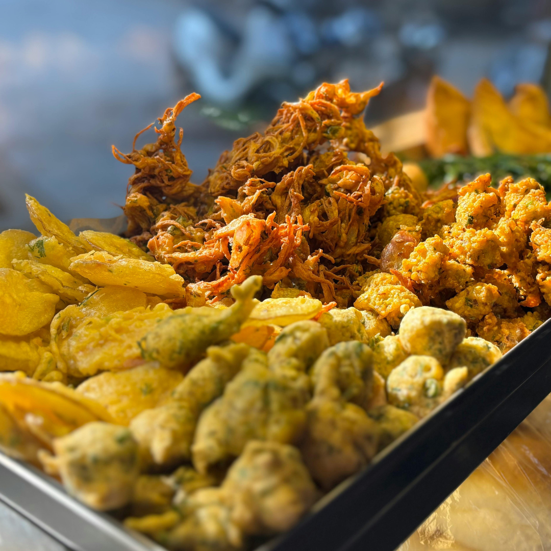 Tourists posing at a Bollywood film city gate